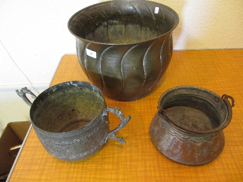 Circular brass coal bucket together with a silver on copper iron handled cooking pot and a Persian