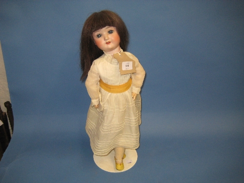 Simon Halbig bisque headed doll with sleeping eyes and open mouth on a jointed composition body with