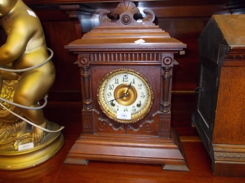 19th Century Continental walnut two train mantel clock striking on a gong