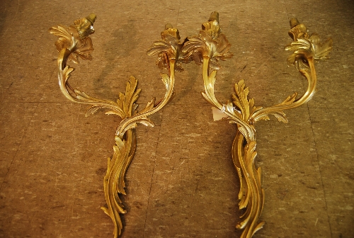 Pair of 20th Century rococo style gilt brass two branch wall sconces