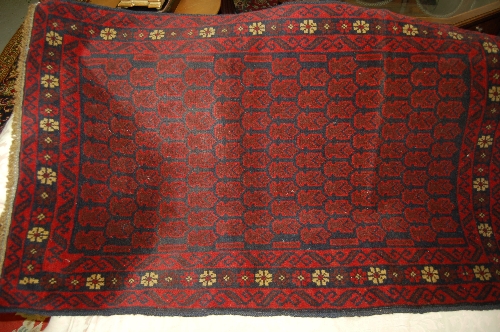 Belouch rug on blue ground, 1.35 x 0.87m