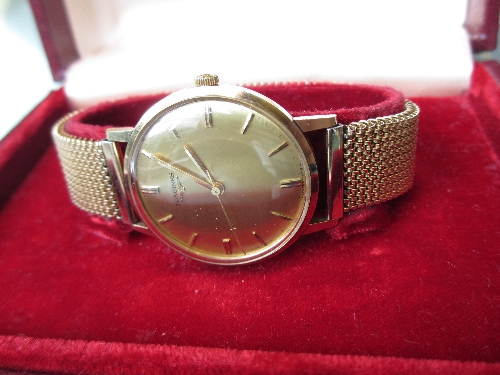 Gentlemans yellow metal cased Longines wristwatch, the champagne dial with baton numerals and