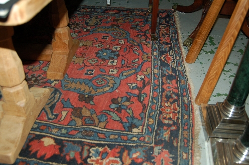 Small Hamadan rug with stylised floral design on pink ground with borders