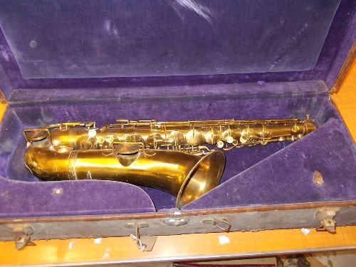 Cased brass tenor saxophone