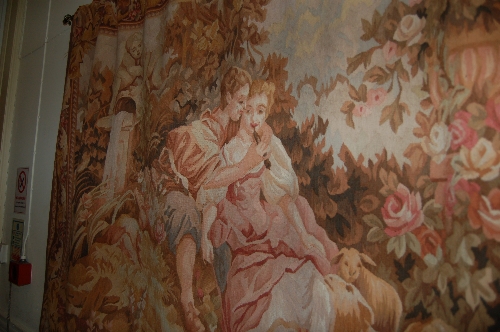 Aubusson style tapestry panel depicting lovers in a landscape
