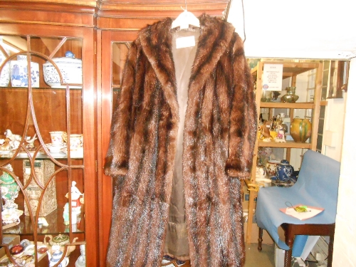 Ladies three quarter length dark brown fur coat together with a simulated fur coat