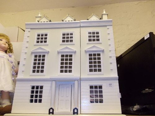White painted wooden dolls house