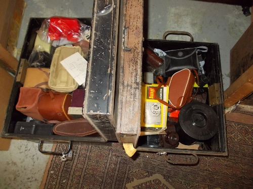 Two tin trunks containing a large quantity of 1930`s and later cameras and accessories