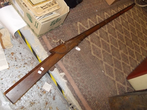 Antique large bore Matchlock rifle with an oak stock