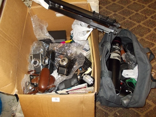 Large box containing a quantity of various SLR cameras, a bag containing a quantity of various