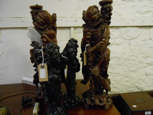 Pair of large Chinese carved hardwood lamp bases and a pair of similar figures