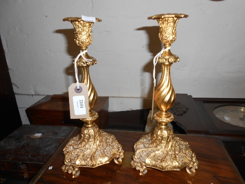 Pair of ormolu candlesticks, the removable sconces above floral chased and wrythen baluster stems on