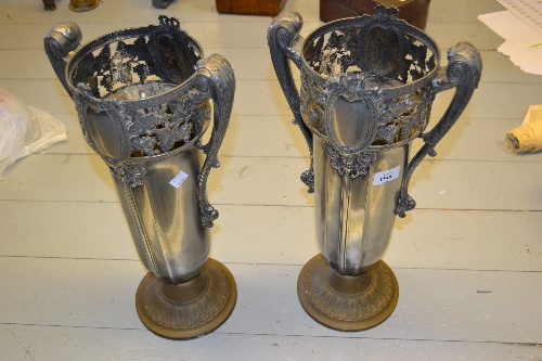 Pair of large early 20th Century silvered metal two handled pedestal vases in Art Nouveau style, the
