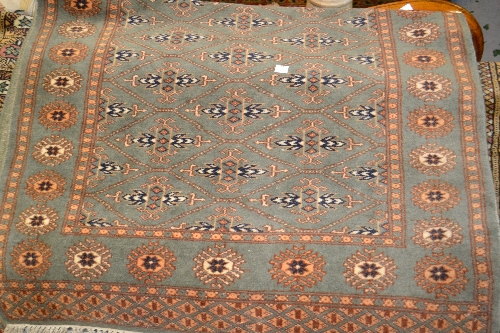 Two Pakistan Bokhara type rugs with green ground