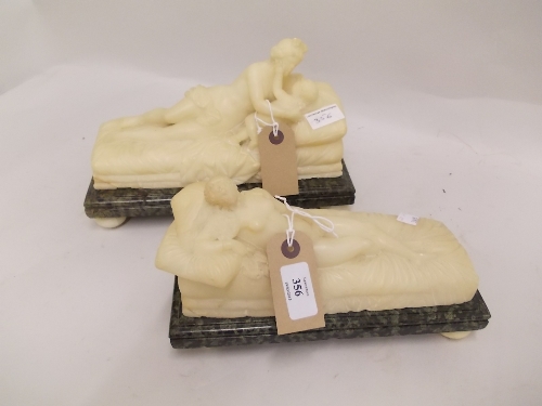 Pair of carved alabaster figures of reclining classical maidens on rectangular marble bases