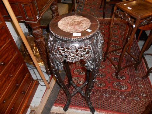 Late 19th or early 20th Century Chinese carved hardwood vase stand with marble inset top decorated