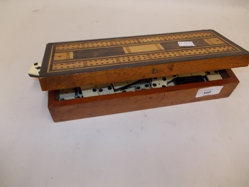 19th Century mahogany cribbage board together with a quantity of bone and ebony dominoes