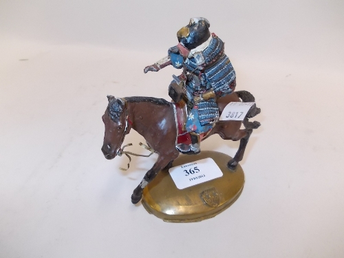 Patinated metal figure of a Samurai warrior on horseback