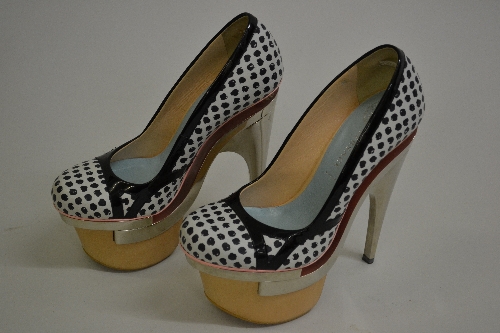 Pair of ladies Versace shoes decorated with a polka dot design, the soles with extreme chrome plated