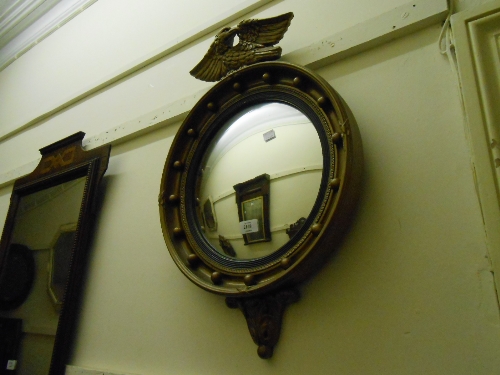 Reproduction circular gilt framed ball pattern convex mirror with eagle surmount