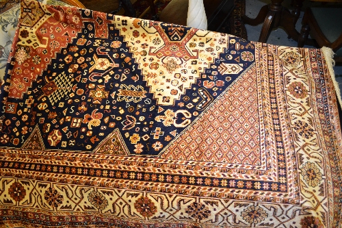 Caucasian style carpet on navy ground, 2.8m x 2m