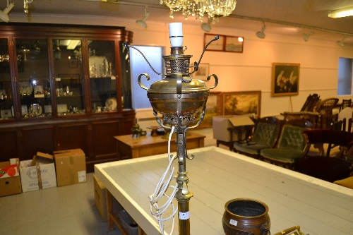 Early 20th Century brass telescopic standard lamp on three claw supports