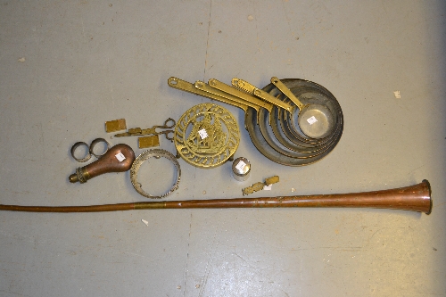 Copper post horn, graduated set of frying pans, a powder flask and small quantity of other metal