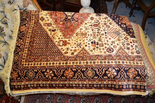 Caucasian design carpet on beige ground, 2.3m x 1.6m