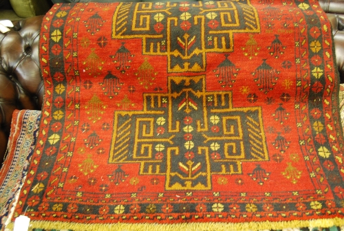 Belouch rug having red ground, 2m x 1.1m