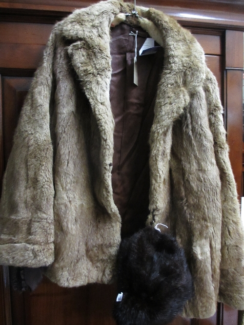 Ladies medium brown fur jacket together with a dark fur hat