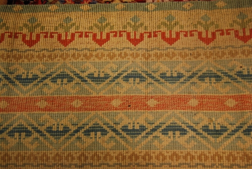 Three various floral decorated rugs