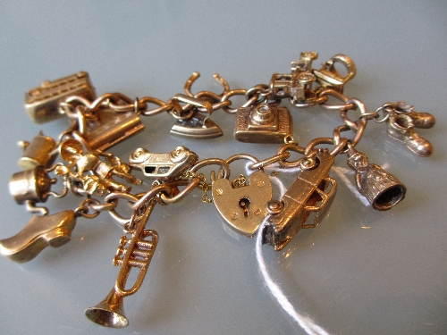 9ct Gold charm bracelet with various charms