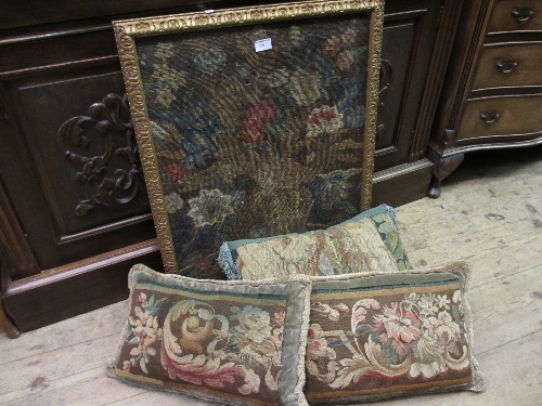 Group of three cushions with antique tapestry fragments applied and a framed Berlin floral