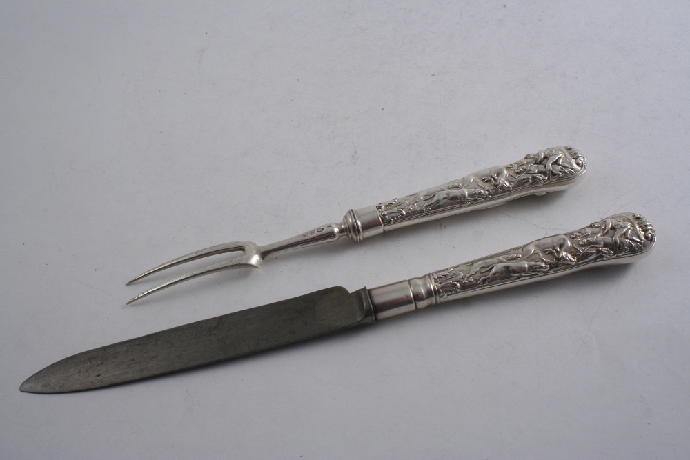 A GEORGE III STAG HUNT PATTERN SERVING FORK & A SERVING KNIFE (steel blade), probably by Paul