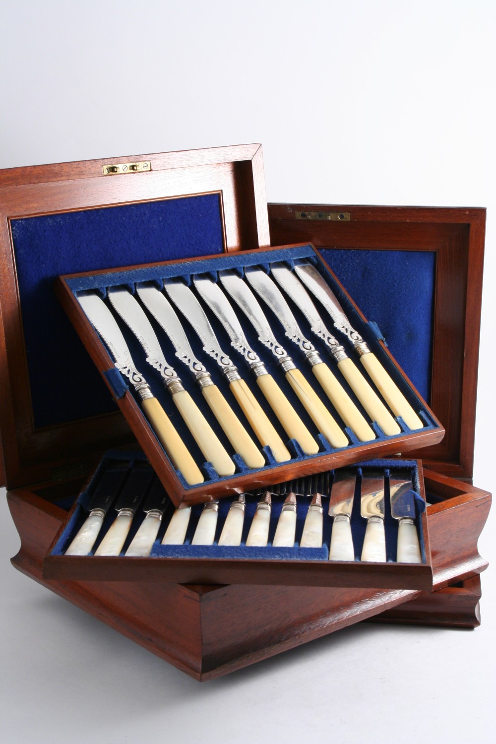 A VICTORIAN CASED SET OF TWENTY FOUR PAIRS OF PLATED DESSERT KNIVES & FORKS with mother of pearl