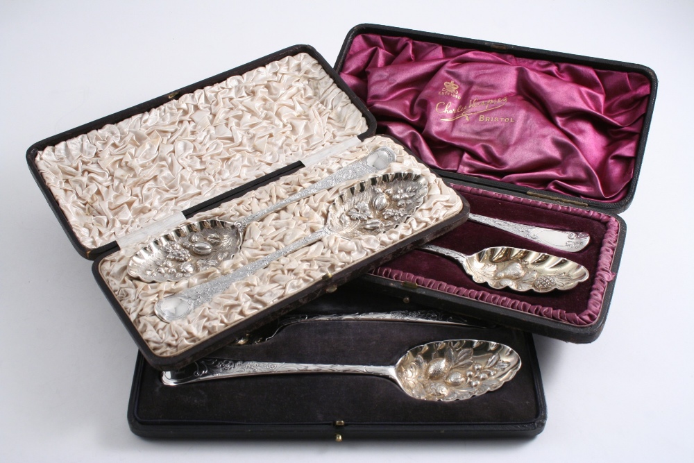 THREE CASED PAIRS OF LATER-DECORATED OR "BERRY" TABLE SPOONS with gilt bowls; 12.9 oz (3)