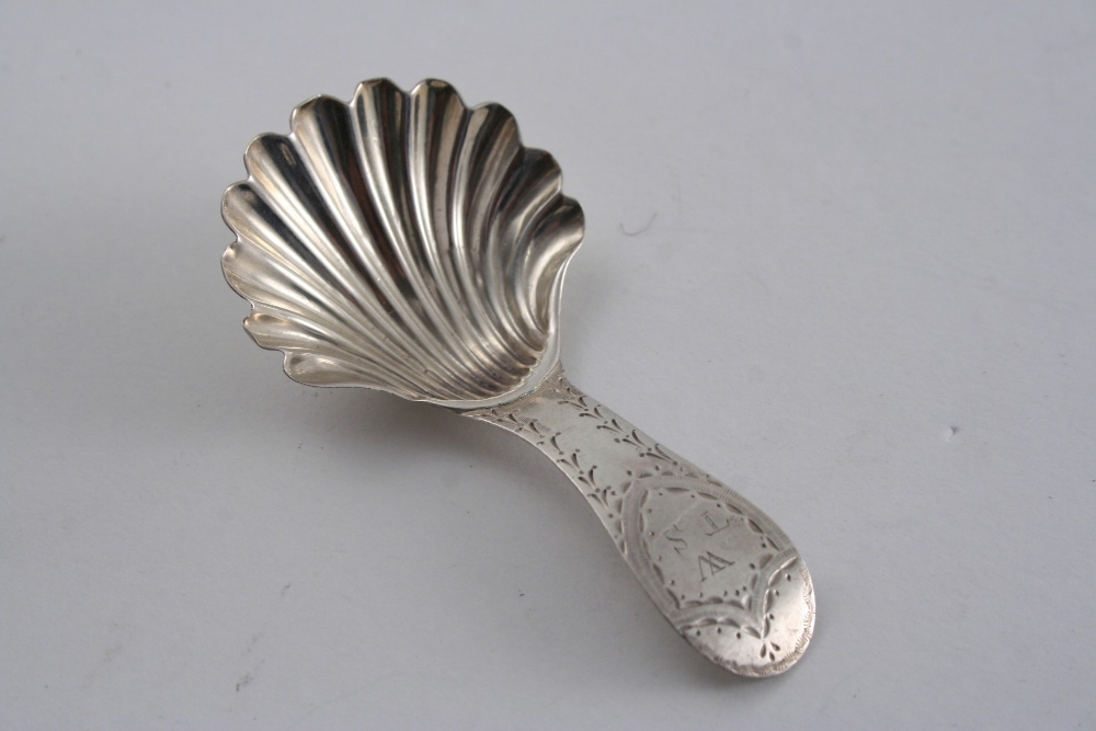 BY HESTER BATEMAN: A George III caddy spoon with a fluted shell bowl & a bright-engraved stem,