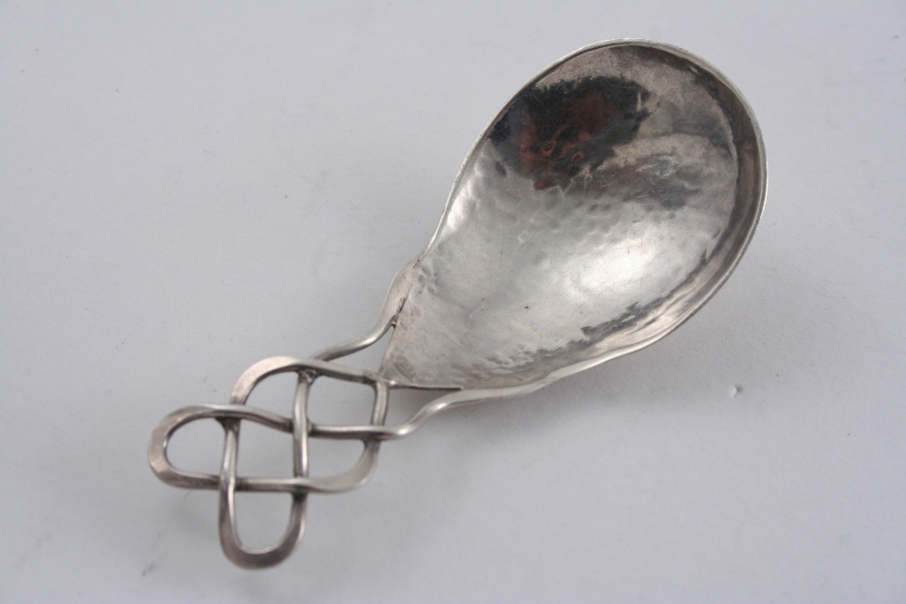A MODERN HANDMADE CADDY SPOON with an interwoven, wire stem by the Keswick School of Industrial
