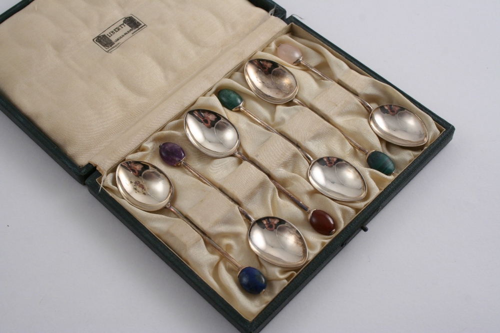 BY LIBERTY & CO: A modern cased set of six coffee spoons, each with a different coloured