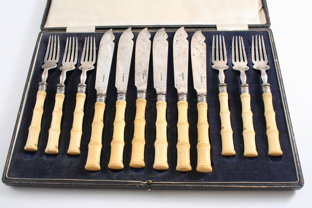 A VICTORIAN CASED SET OF SIX PAIRS OF ENGRAVED FISH KNIVES & FORKS with ivory "bamboo" handles, by