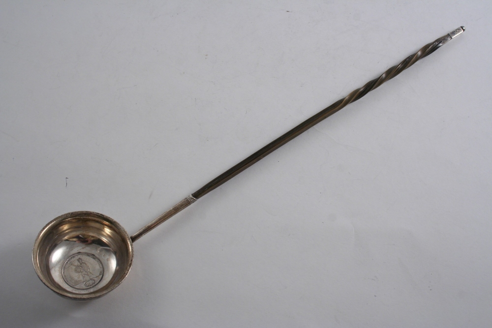 AN INTERESTING SCOTTISH PROVINCIAL PUNCH LADLE with a whalebone handle & a circular bowl, inset in