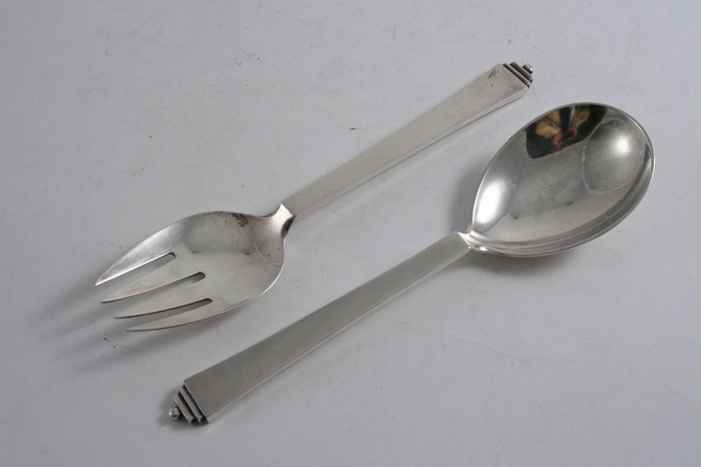 BY GEORG JENSEN: A modern Danish, Pyramid pattern serving spoon & fork with English import marks for