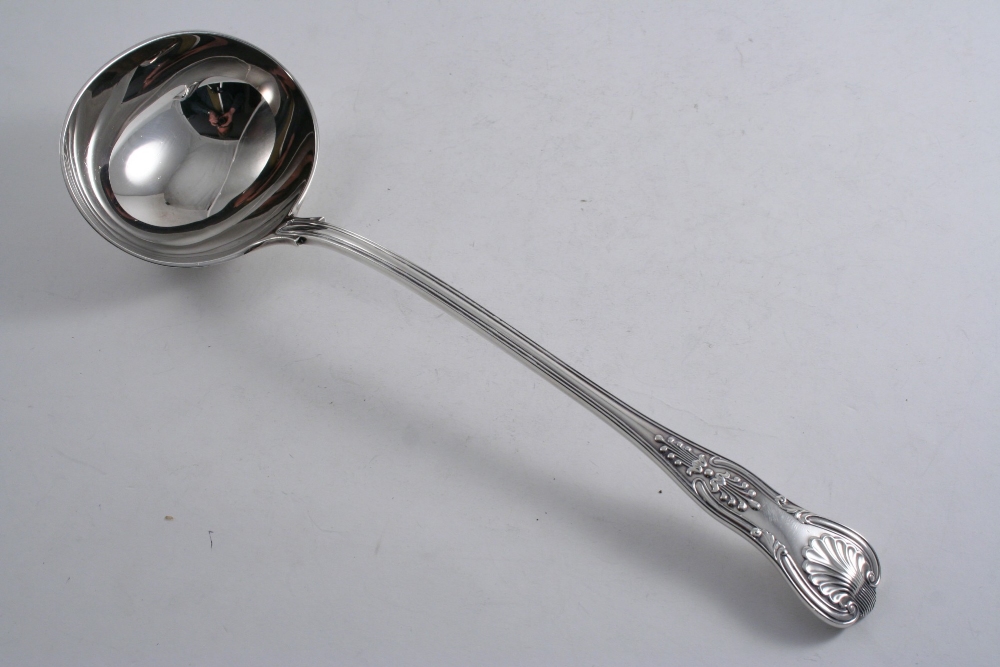 A LATE VICTORIAN KING`S PATTERN SOUP LADLE by W. Gibson & J. Langman, London 1892; 13.3" (34 cms)