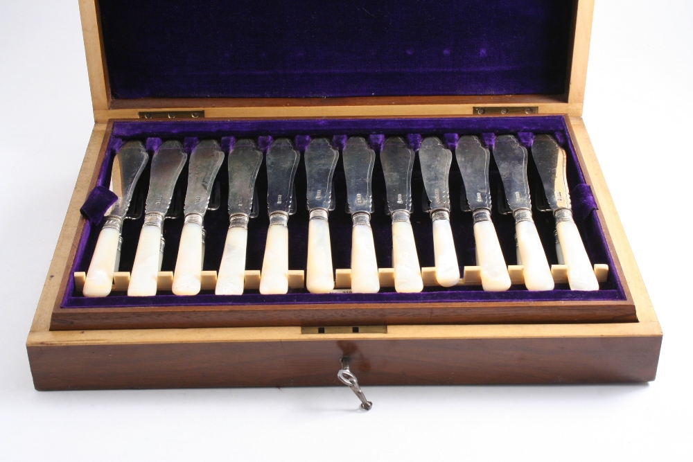 A LATE VICTORIAN CASED SET OF TWELVE PAIRS OF MOTHER OF PEARL HANDLED FISH KNIVES & FORKS by J &