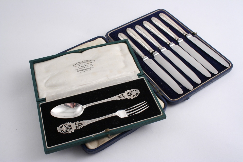 A CASED MODERN CHILD`S SPOON & FORK pierced & engraved with thistle terminals, by Wilson & Sharp (of