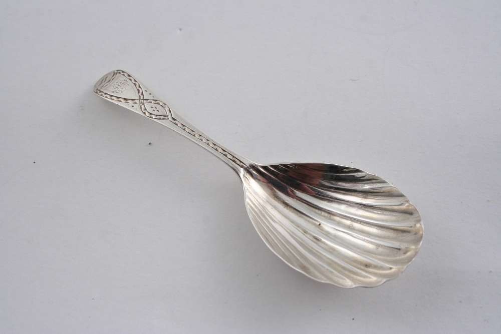 A GEORGE III CADDY SPOON with a fluted bowl & a bright-cut stem, initialled, by Benjamin