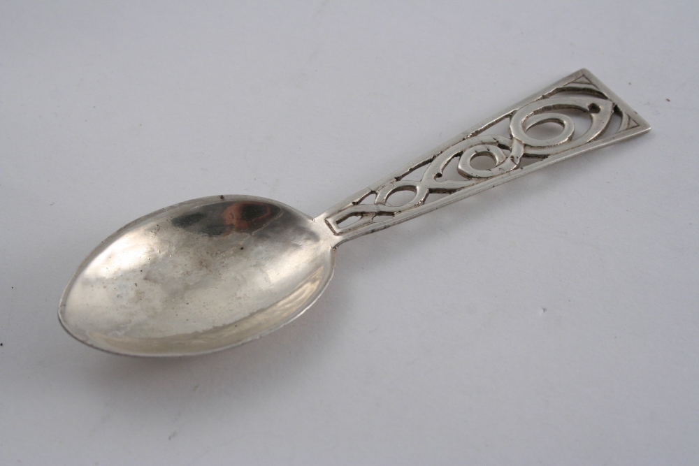 A MODERN HANDMADE CADDY SPOON with a pierced, tapering stem & a navette-shaped bowl, by Amy