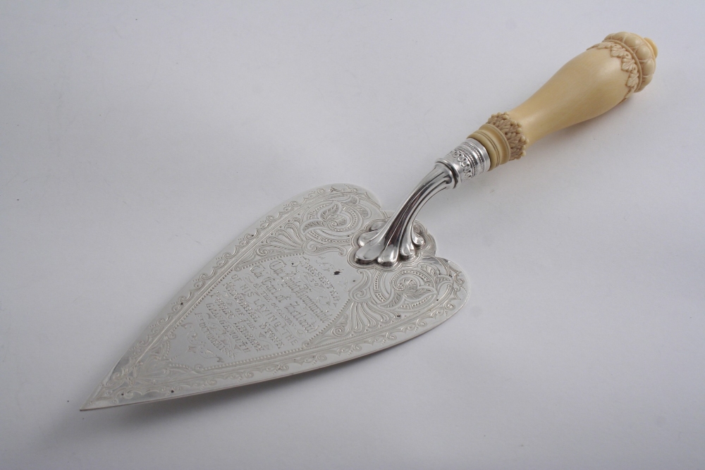 A VICTORIAN ENGRAVED PRESENTATION TROWEL with a carved ivory handle, inscribed "Presented to the