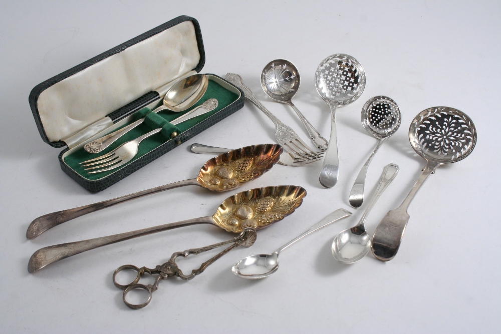 A MIXED LOT: Four various sugar sifter ladles, a pair of 18th century Irish sugar nips, a pair of