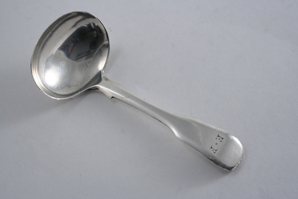 A GEORGE III NORTH COUNTRY PROVINCIAL FIDDLE PATTERN CADDY SPOON initialled "E.F.", probably by John